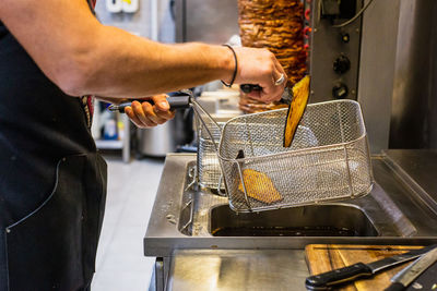 Midsection of chef preparing food