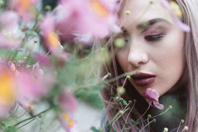 Portrait of woman with pink flowers