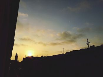 Low angle view of building against sky at sunset