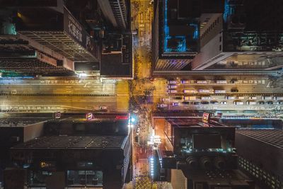 Directly above shot of illuminated buildings and street in city at night