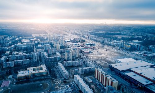 High angle view of buildings in city during sunset