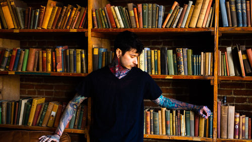 Portrait of woman standing in library