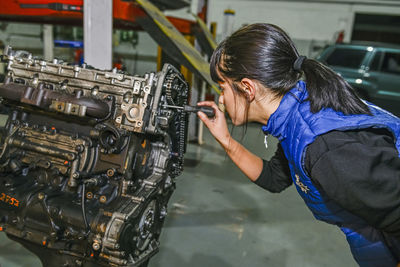 Side view of man working at workshop