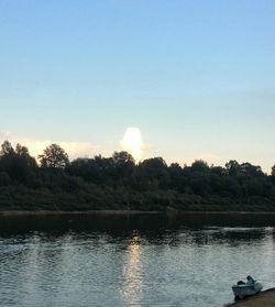 Scenic view of calm lake at sunset