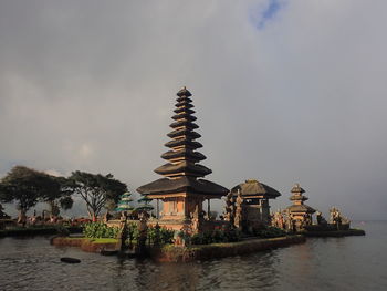 View of temple against cloudy sky