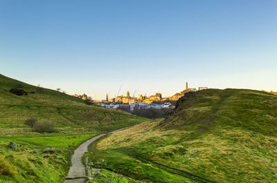 Old town of edinburgh with landscape of mountain at holyrood park