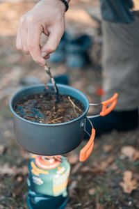 Midsection of man holding ice cream
