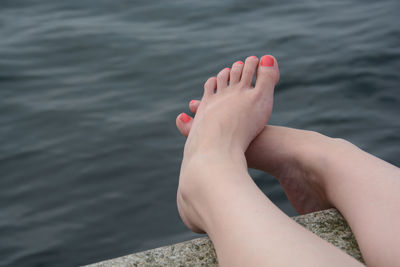 Feet of woman in water