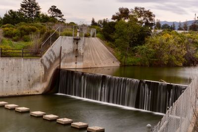 View of dam by lake