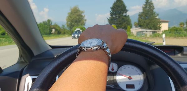 Close-up of hand on car