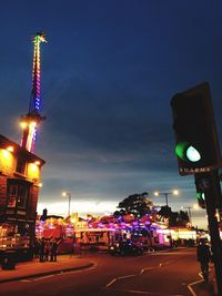 View of illuminated street lights at night