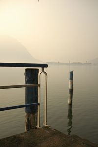 Cropped railing against calm sea