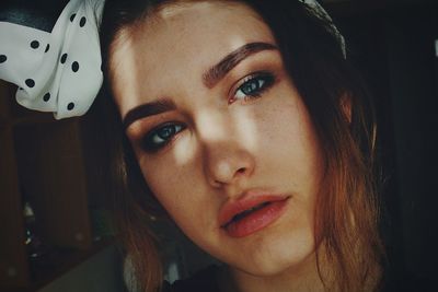 Close-up portrait of young woman wearing headscarf