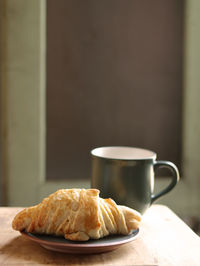 Close-up of coffee cup on table