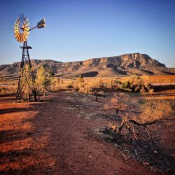 Scenic view of land against clear blue sky