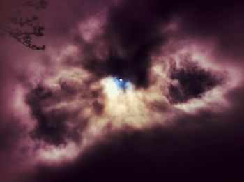 Low angle view of cloudy sky at night