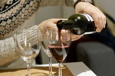 Close-up of wine glasses on table