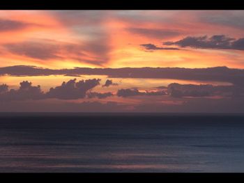 Scenic view of dramatic sky during sunset