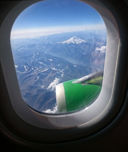 Aerial view of landscape seen through airplane window