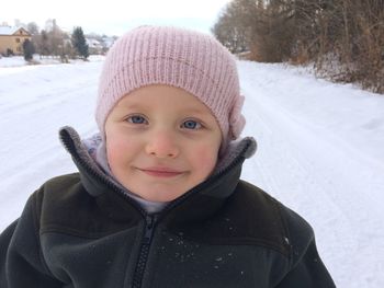 Portrait of smiling boy in snow