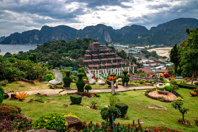 High angle view of buildings against cloudy sky