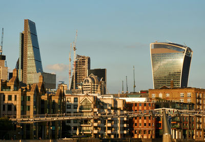 Modern buildings in city against sky