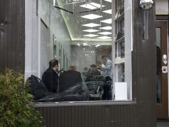 People sitting in front of window