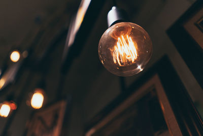 Low angle view of illuminated light bulb