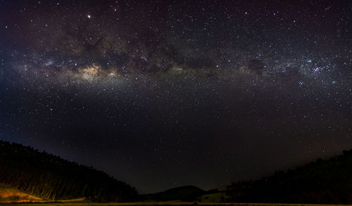 Scenic view of star field against sky at night