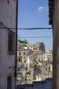 Buildings in city against sky