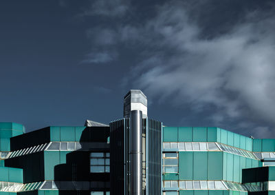 Low angle view of factory against sky