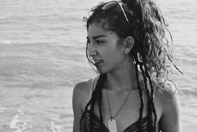 Close-up portrait of young woman at beach