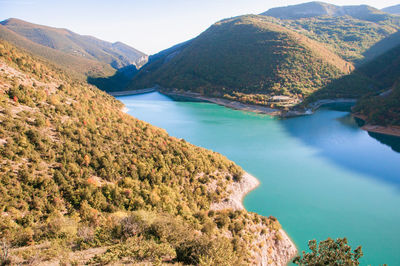 Scenic view of lake and mountains against sky