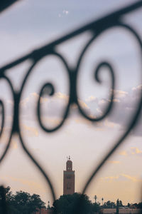Low angle view of clock tower against building