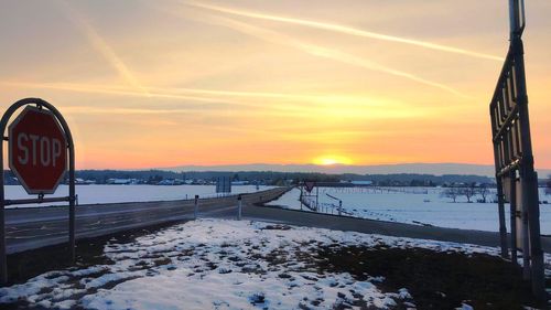 Scenic view of frozen sea against sky during sunset