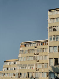 Low angle view of building against clear blue sky