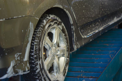 Car with soap sud in garage