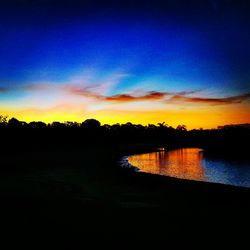 Scenic view of lake at sunset