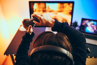 Man playing video game. gamer holding joystick. playing tournament of championship. competition