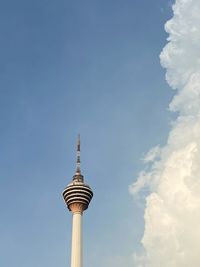 Low angle view of communications tower against sky