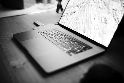 Close-up of laptop on table at home