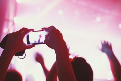 Close-up of hands photographing with mobile phone