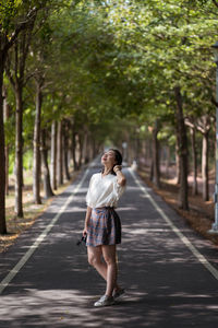 Full length of man standing on road