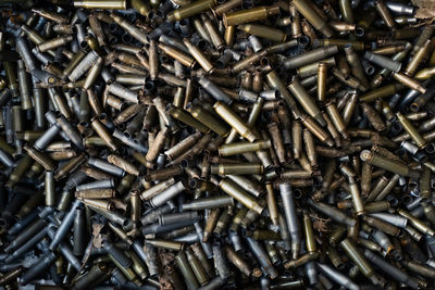 Empty carbine or rifle cartridges. a large number of cases. background of brass ammunition 
