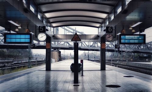 Rear view of woman at railroad station