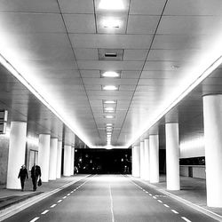 People walking on empty road