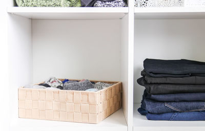 Clothes in shelves at home
