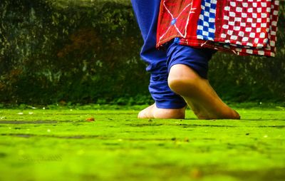 Woman standing on grass