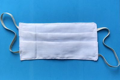 Directly above shot of white table against blue background