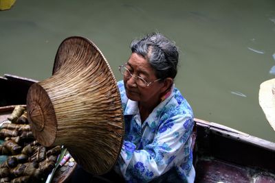 Close-up of woman standing against wall